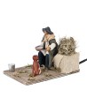 Man giving water to the dog in motion 12 cm for nativity scene