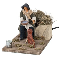 Man giving water to the dog in motion 12 cm for nativity scene