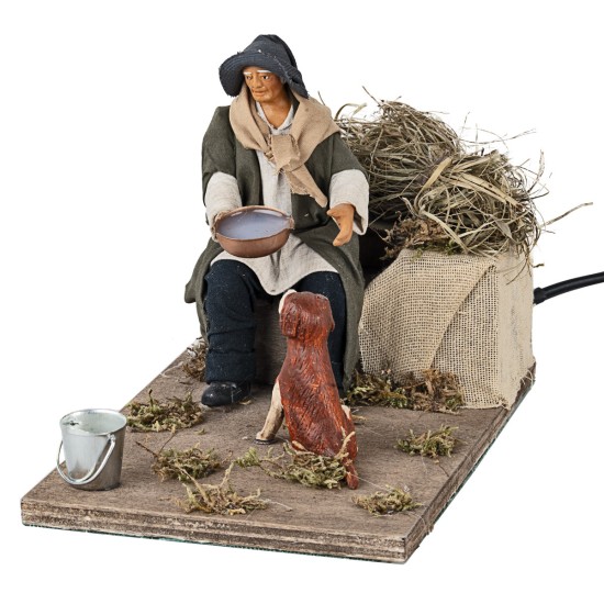 Man giving water to the dog in motion 12 cm for nativity scene