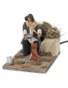 Man giving water to the dog in motion 12 cm for nativity scene
