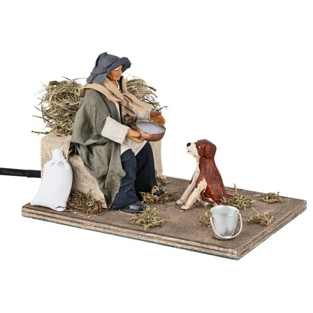 Uomo che da da bere al cane in movimento 12 cm per presepe