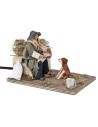 Man giving water to the dog in motion 12 cm for nativity scene