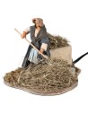 Peasant woman spreading straw in motion 12 cm for Mondo nativity scene