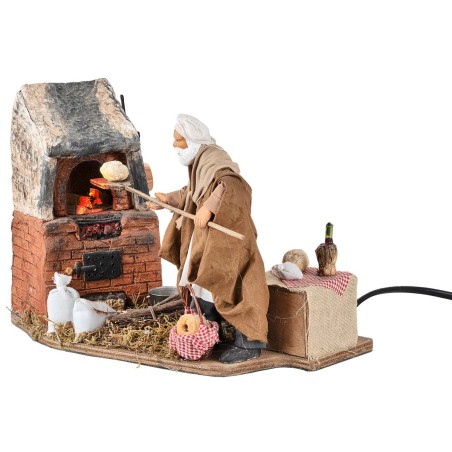 Panadero con horno en movimiento 14 cm para belén Mundo