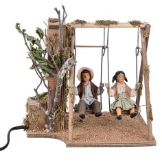 Bimbi su altalena in movimento 24 cm per presepe Mondo Presepi