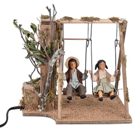 Bimbi su altalena in movimento 24 cm per presepe Mondo Presepi