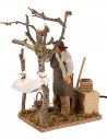 Man collecting moving olives 14 cm for nativity scene