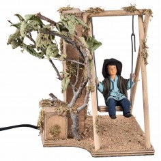 Niño en columpio en movimiento 24 cm para belén Mondo Presepi