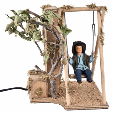 Child on a moving swing 24 cm for nativity scene Mondo Presepi