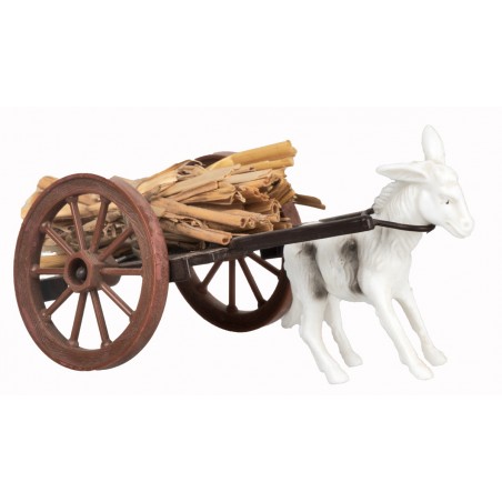 Straw wagon with donkey being towed
