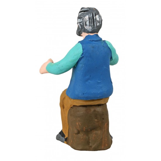 Seated man with glass in hand from the 10 cm series in painted