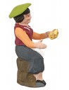 Donna seduta con pane della serie 10 cm in terracotta dipinta