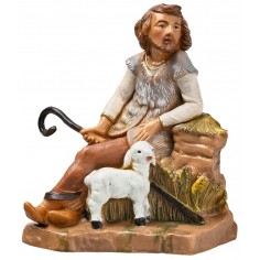 Seated shepherd with sheep from the 12 cm Fontanini series for