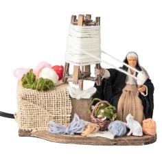 Old woman spinning wool 10 cm in motion for nativity scene World