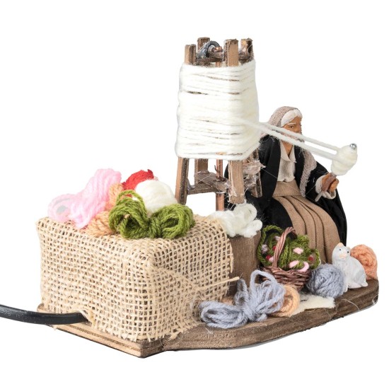 Old woman spinning wool 10 cm in motion for nativity scene World