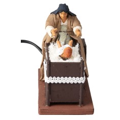 Mother taking baby from cradle series 12 cm in motion for