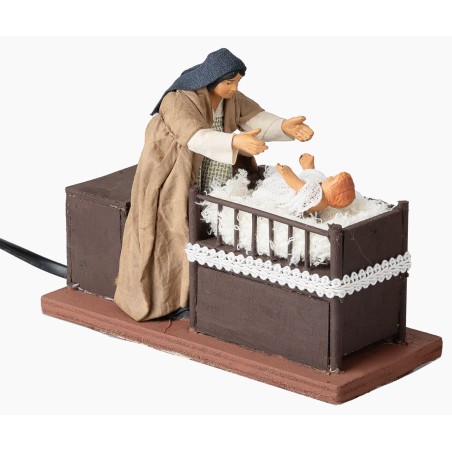 Mother taking baby from cradle series 12 cm in motion for