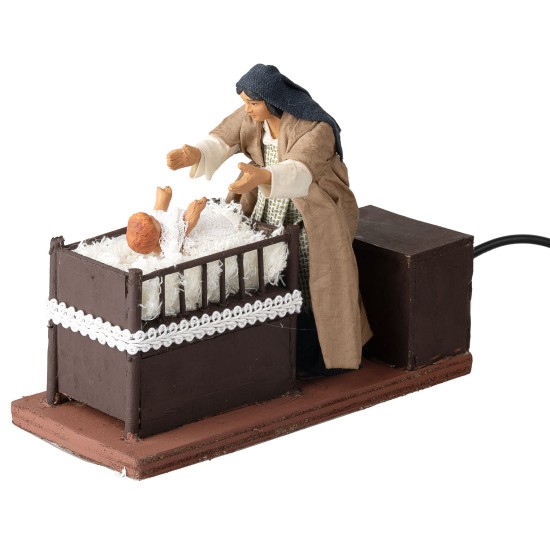 Mother taking baby from cradle series 12 cm in motion for