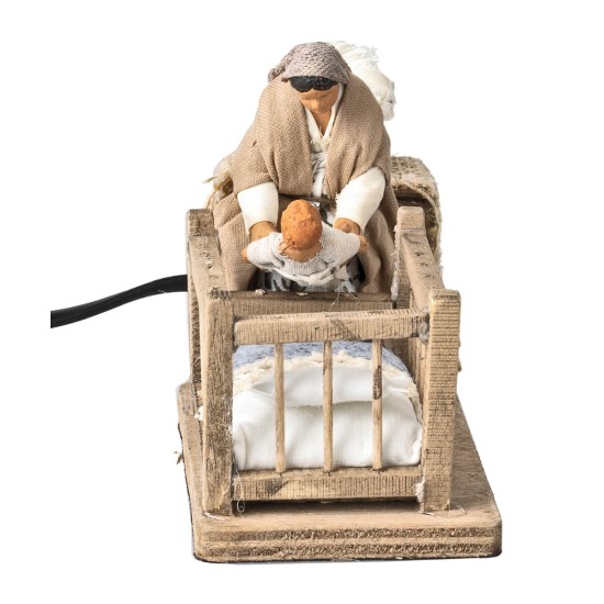 Mom taking baby from the cradle series 10 cm in motion for