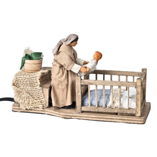 Mom taking baby from the cradle series 10 cm in motion for