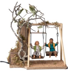 Pair of children on a swing cm 14 in motion for nativity scene