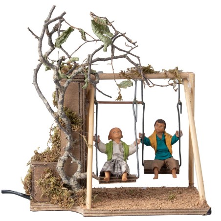 Coppia di bambini su altalena cm 14 in movimento per presepe