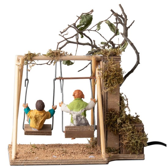 Coppia di bambini su altalena cm 14 in movimento per presepe
