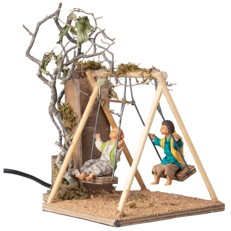 Coppia di bambini su altalena cm 14 in movimento per presepe