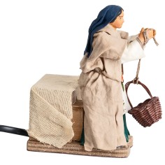 Woman lowering basket 12 cm in motion for Nativity Scene World 2