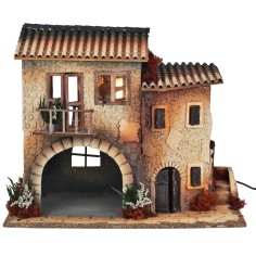 Illuminated village with moving woman cm 50x30x41.5 h