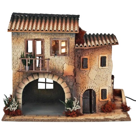 Illuminated village with moving woman cm 50x30x41.5 h