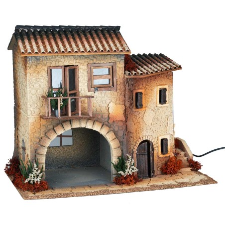 Illuminated village with moving woman cm 50x30x41.5 h