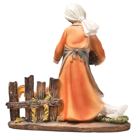 Resin peasant woman feeding chickens for Mondo Nativity scene