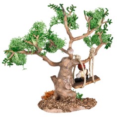 Niño sobre el columpio atado a un árbol para el belén 2