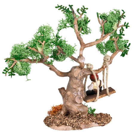 Child on the swing attached to a tree for nativity scene