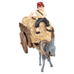 Man on donkey carrying a cart loaded with hay for 2
