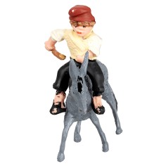 Man on a donkey transporting a cart loaded with hay for