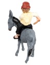 Man with whip riding a donkey