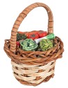 Cesto in miniatura in vimini con verdure assortite.