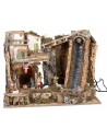 Illuminated nativity scene with steep waterfall and Landi