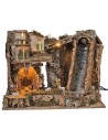 Illuminated nativity scene with steep waterfall and Landi