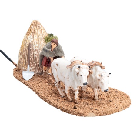 Contadino con buoi e aratro in movimento 10 cm per presepe