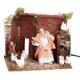 Campesina con gallinas 10 cm en movimiento cm 17x14x14 h
