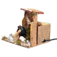 Campesino con conejos 7 cm en movimiento cm 17x14x14 h para