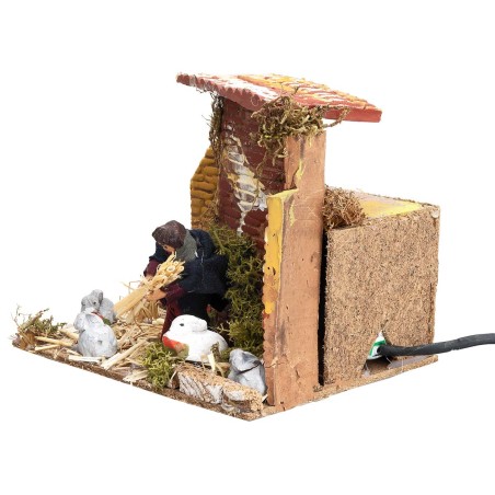 Campesino con conejos 7 cm en movimiento cm 17x14x14 h