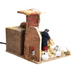 Campesino con conejos 7 cm en movimiento cm 17x14x14 h 2