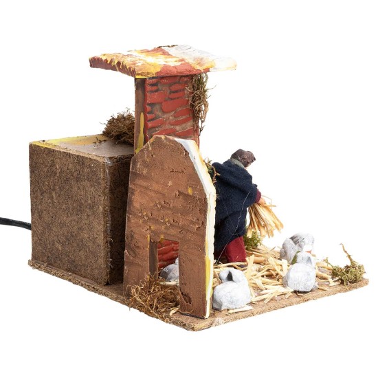 Farmer with rabbits 7 cm in motion 17x14x14 cm h for