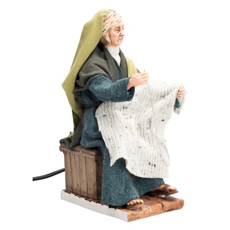 Donna in stile arabo che cuce con doppio movimento serie 30 cm