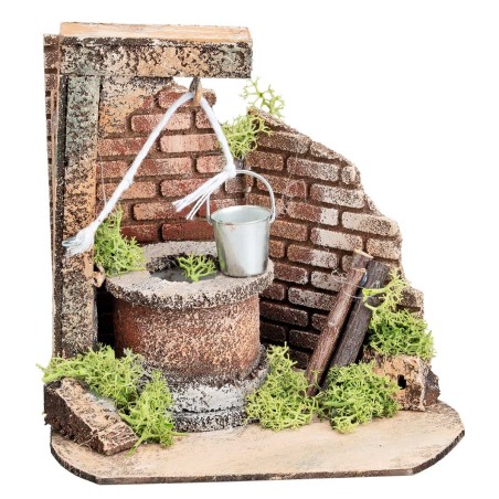 Well with bucket and side brick wall for statues from