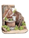 Well with bucket and side brick wall for statues from
